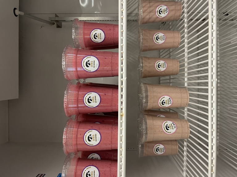 Refrigerator with strawberry banana smoothies.