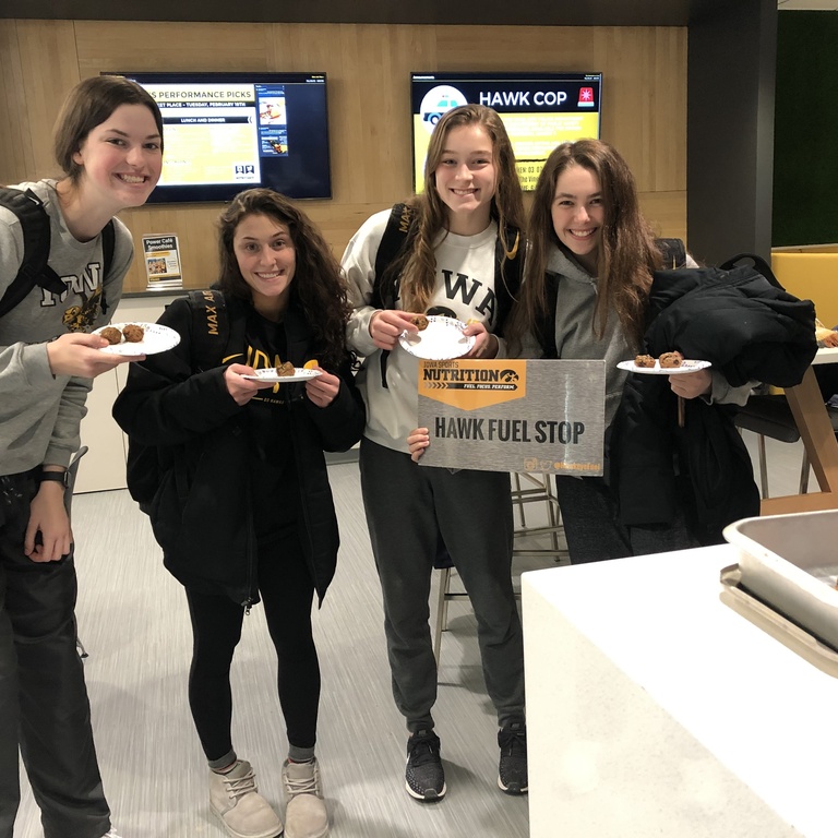 Student-athletes sample new foods at a Hawk Fuel Stop in Gerdin Athletic Learning Center.