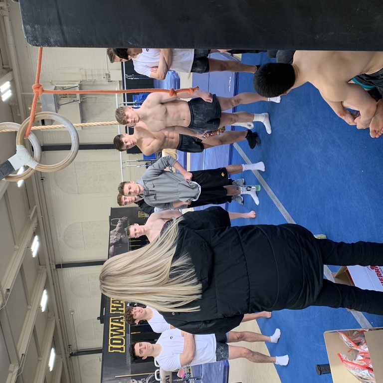 Gymnastics student-athletes listen to a team talk from a Sports Dietitian. 